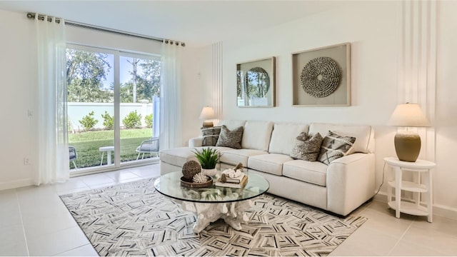 living room featuring baseboards and tile patterned flooring