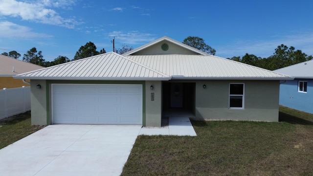 12263 Cartouche Ave, Punta Gorda, FL 33955 - single story home featuring a front lawn, stucco siding, metal roof, and a garage