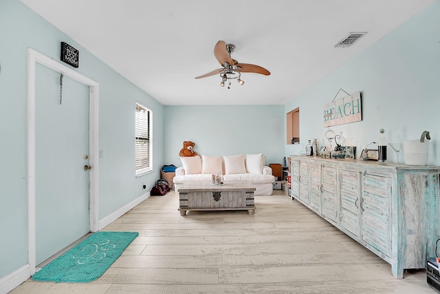 1742 SW Hampshire Ln, Port Saint Lucie, FL 34953 - bedroom with light wood-type flooring, ceiling fan, and baseboards