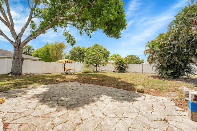 1742 SW Hampshire Ln, Port Saint Lucie, FL 34953 - view of patio / terrace with a fenced backyard