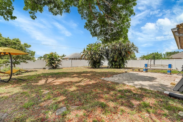1742 SW Hampshire Ln, Port Saint Lucie, FL 34953 - fenced backyard with a patio