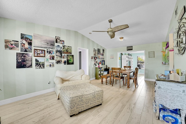 1742 SW Hampshire Ln, Port Saint Lucie, FL 34953 - dining room featuring wood finished floors, vaulted ceiling, a ceiling fan, and baseboards