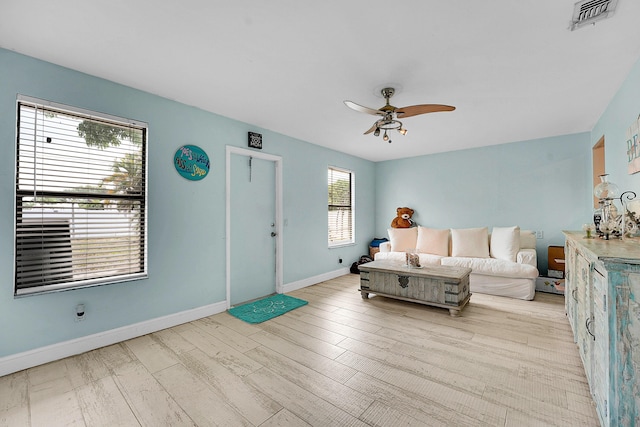 1742 SW Hampshire Ln, Port Saint Lucie, FL 34953 - bedroom with baseboards, wood finished floors, and ceiling fan