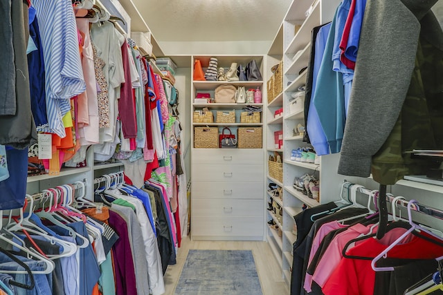 spacious closet with wood finished floors