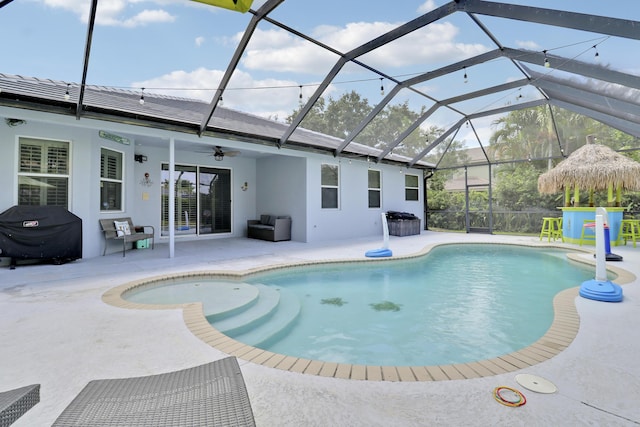outdoor pool featuring a patio, a grill, a ceiling fan, and glass enclosure