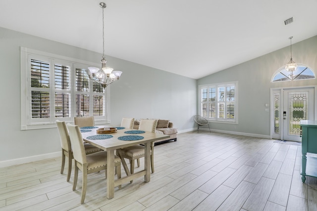 dining space featuring an inviting chandelier, light wood-type flooring, visible vents, and baseboards