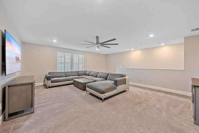 656 SE Villandry Way, Port Saint Lucie, FL 34984 - living room featuring light carpet, baseboards, ceiling fan, and recessed lighting
