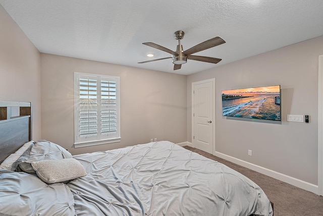 656 SE Villandry Way, Port Saint Lucie, FL 34984 - carpeted bedroom featuring baseboards, ceiling fan, and a textured ceiling
