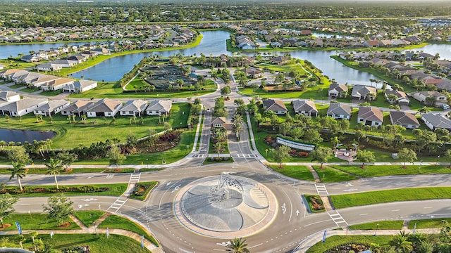 656 SE Villandry Way, Port Saint Lucie, FL 34984 - aerial view of property and surrounding area featuring nearby suburban area and a large body of water