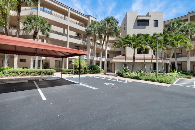 7546 La Paz Blvd Unit 106, Boca Raton, FL 33433 - view of apartment building / complex featuring covered and uncovered parking
