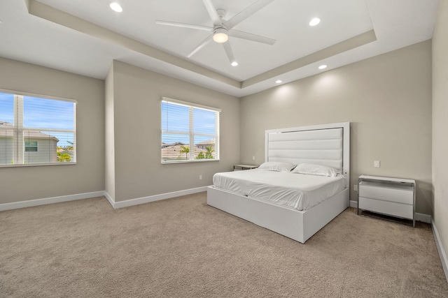 5651 Macoon Way, Westlake, FL 33470 - bedroom with a tray ceiling, baseboards, multiple windows, and recessed lighting