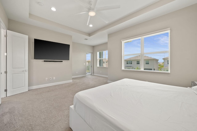 5651 Macoon Way, Westlake, FL 33470 - bedroom featuring a tray ceiling, baseboards, recessed lighting, light carpet, and ceiling fan
