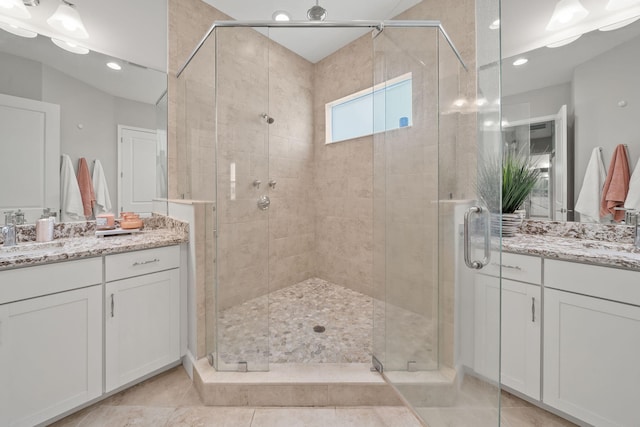 5651 Macoon Way, Westlake, FL 33470 - bathroom with a shower stall, two vanities, recessed lighting, and tile patterned floors