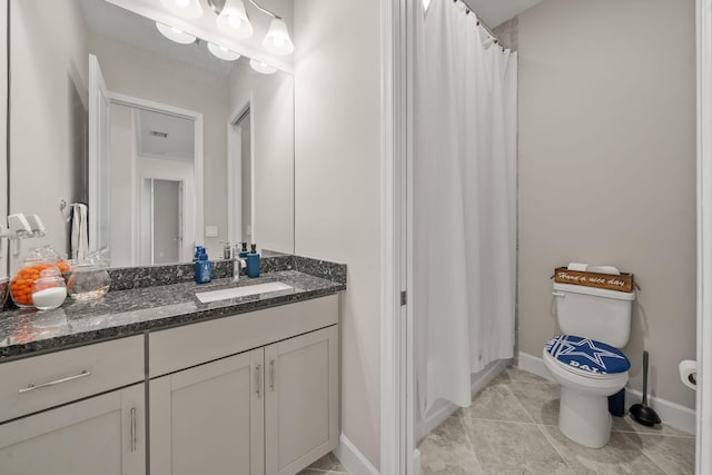 5651 Macoon Way, Westlake, FL 33470 - bathroom featuring toilet, vanity, tile patterned flooring, baseboards, and a shower with shower curtain