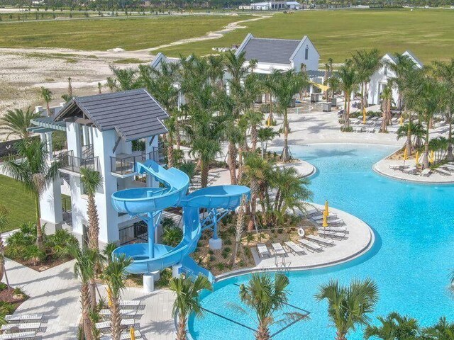 5651 Macoon Way, Westlake, FL 33470 - community pool featuring a water slide