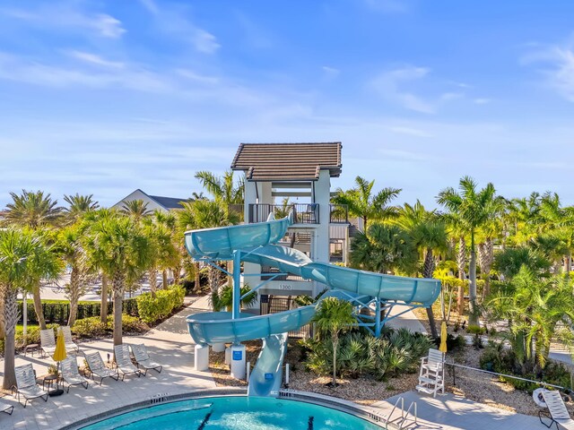 5651 Macoon Way, Westlake, FL 33470 - community pool featuring a water slide, a pergola, and a patio