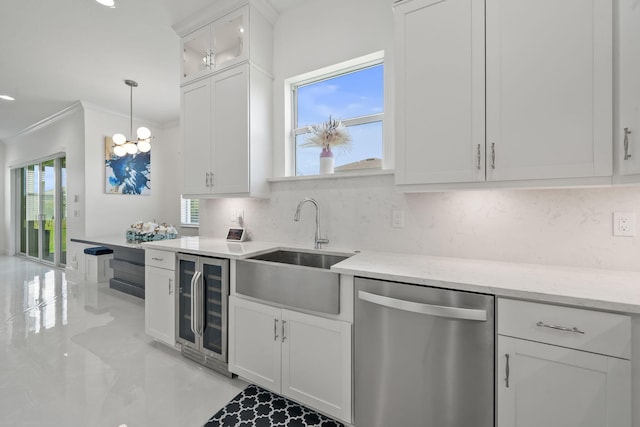 5651 Macoon Way, Westlake, FL 33470 - kitchen with stainless steel dishwasher, crown molding, a sink, beverage cooler, and tasteful backsplash
