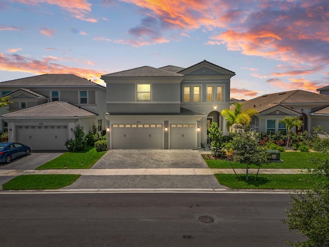 5651 Macoon Way, Westlake, FL 33470 - view of front of house with a garage, stucco siding, and driveway