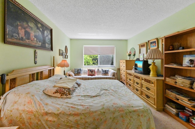 bedroom with carpet and a textured ceiling