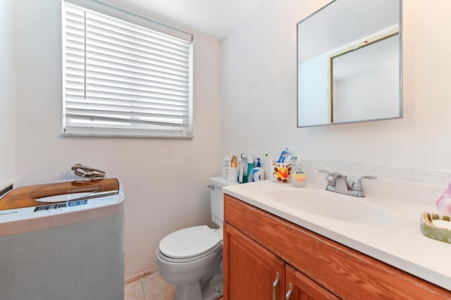 bathroom featuring vanity, toilet, and tile patterned floors