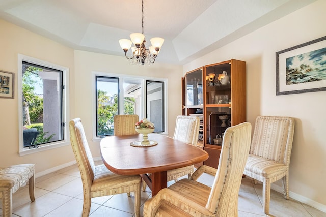 dining room featuring baseboards, a chandelier, and light tile patterned floors