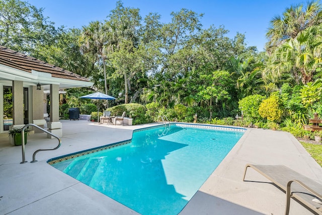 outdoor pool featuring a patio area