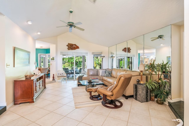 living area featuring baseboards, ceiling fan, light tile patterned flooring, and high vaulted ceiling