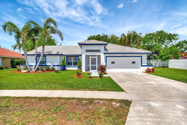 view of front of home with a tiled roof, stucco siding, driveway, and an attached garage