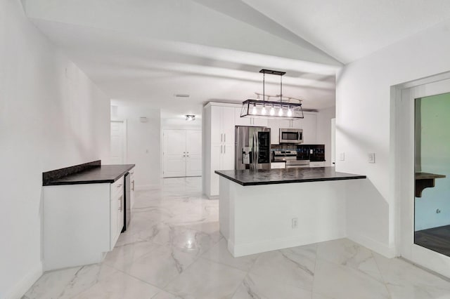 kitchen with appliances with stainless steel finishes, dark countertops, light marble finish flooring, tasteful backsplash, and a peninsula