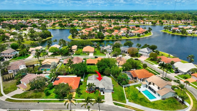 aerial view of residential area with a nearby body of water