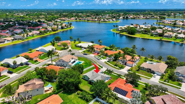 aerial view of residential area with a large body of water