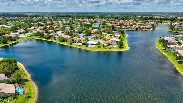 aerial view of residential area with a large body of water
