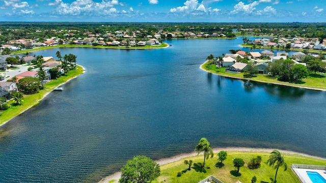 aerial perspective of suburban area featuring a nearby body of water