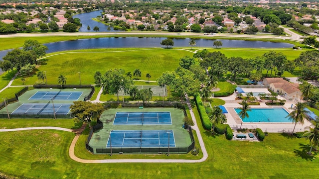 aerial view of a nearby body of water and a pool area