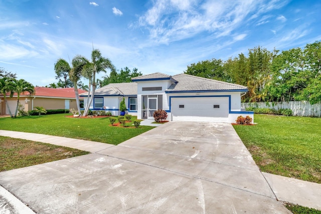 view of front facade with an attached garage, a tiled roof, driveway, and stucco siding