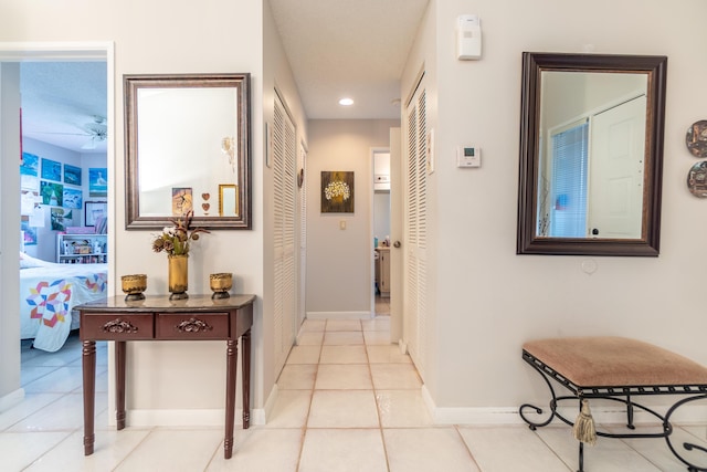 8306 Summersong Ter Unit B, Boca Raton, FL 33496 - corridor featuring baseboards, light tile patterned floors, and recessed lighting