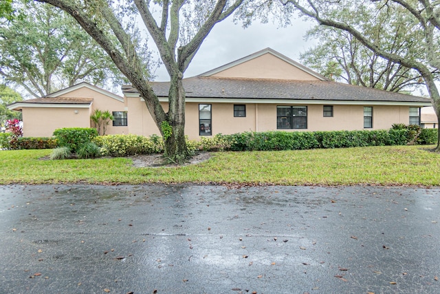8306 Summersong Ter Unit B, Boca Raton, FL 33496 - view of side of property featuring a yard and stucco siding