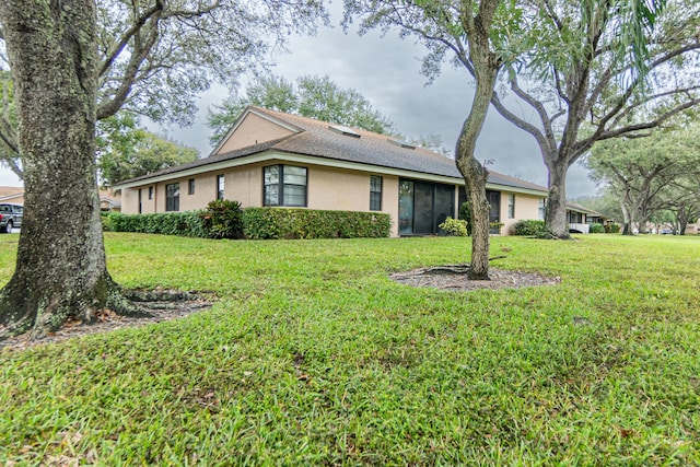 8306 Summersong Ter Unit B, Boca Raton, FL 33496 - view of front of property with a sunroom, stucco siding, and a front yard