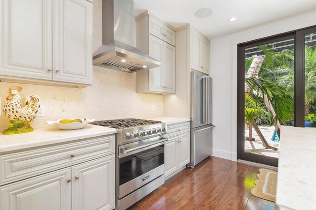 3017 Vincent Rd, West Palm Beach, FL 33405 - kitchen featuring island range hood, stainless steel appliances, healthy amount of natural light, light countertops, and recessed lighting