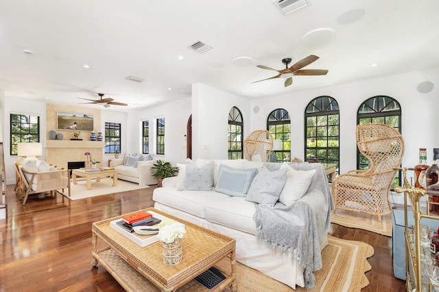 3017 Vincent Rd, West Palm Beach, FL 33405 - living room with a ceiling fan, recessed lighting, wood finished floors, and a large fireplace
