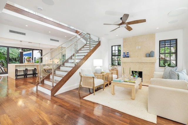3017 Vincent Rd, West Palm Beach, FL 33405 - living room with healthy amount of natural light, wood finished floors, stairs, ceiling fan, and recessed lighting