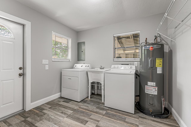laundry room featuring water heater, separate washer and dryer, light wood-style flooring, electric panel, and baseboards
