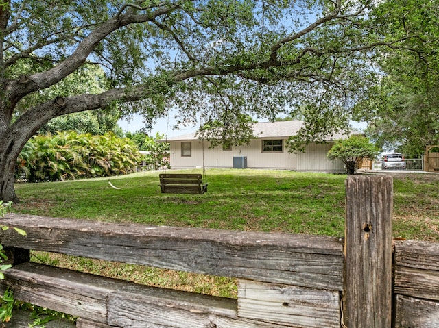 rear view of house with a yard