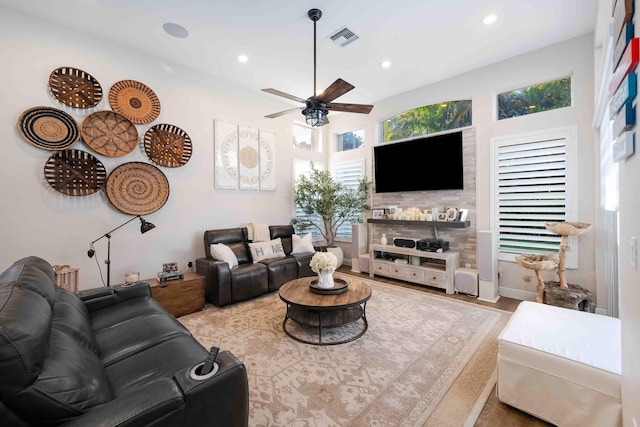 living area with ceiling fan, recessed lighting, and wood finished floors