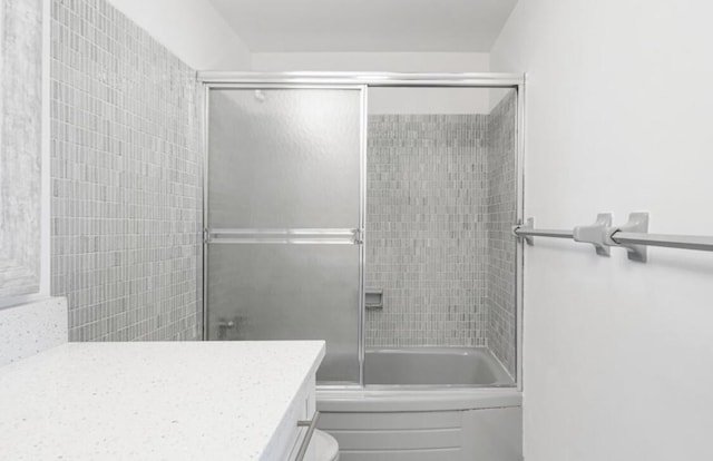 2800 N Flagler Dr Unit 410, West Palm Beach, FL 33407 - full bath with vanity, toilet, and enclosed tub / shower combo