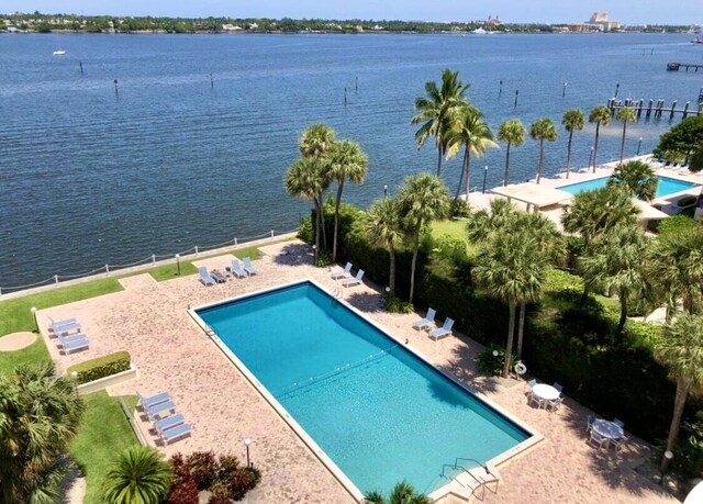 2800 N Flagler Dr Unit 410, West Palm Beach, FL 33407 - pool featuring a patio area and a water view