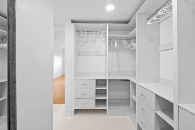 spacious closet featuring light tile patterned floors