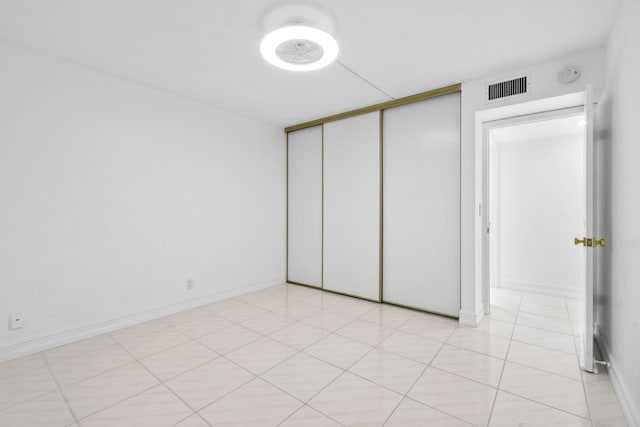 unfurnished bedroom with a closet