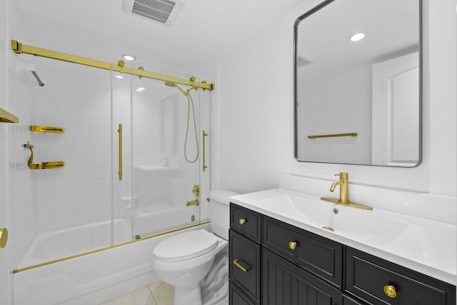 bathroom featuring toilet, vanity, enclosed tub / shower combo, and recessed lighting