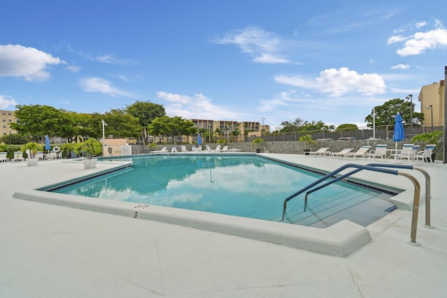 community pool featuring a patio area
